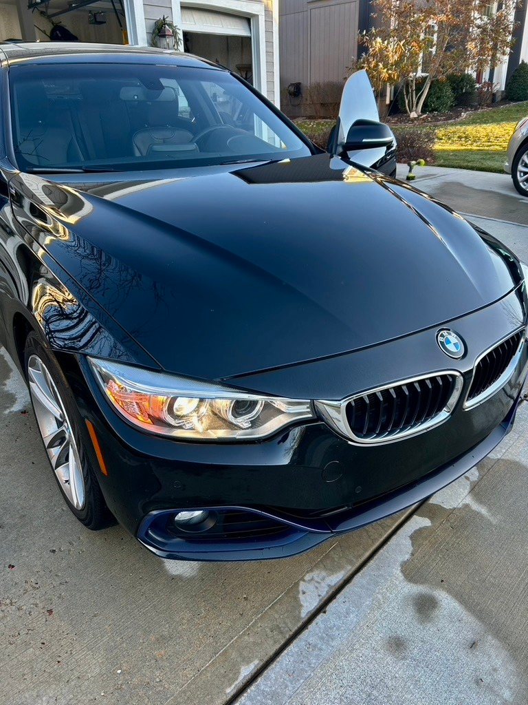 Black BMW with a deep gloss finish after a detail