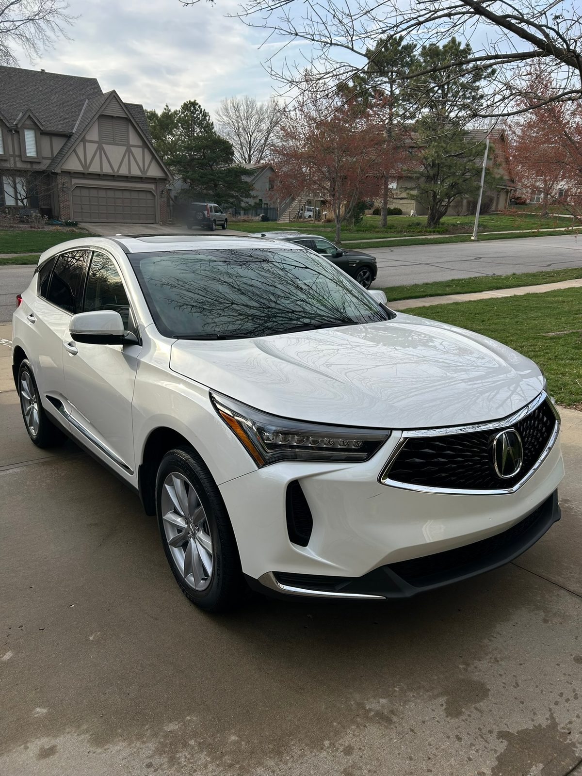 White Acura RDX after a detail in a Leawood driveway
