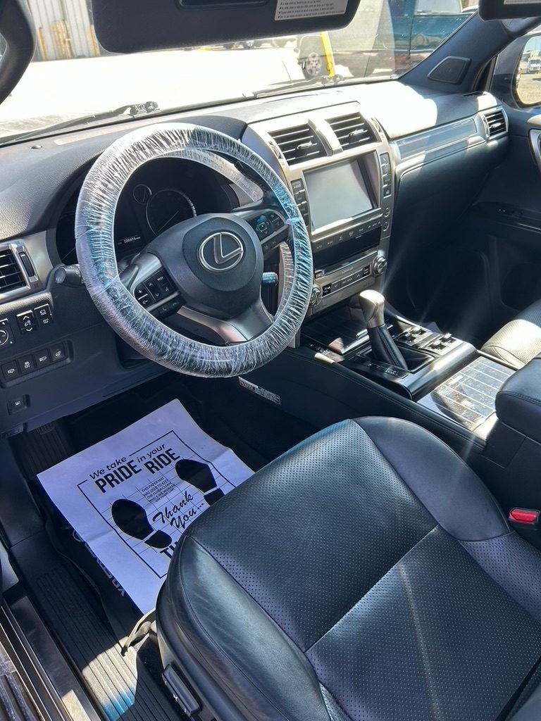 Lexus GX interior with black leather seats after a detail, with a Clarity paper floor mat