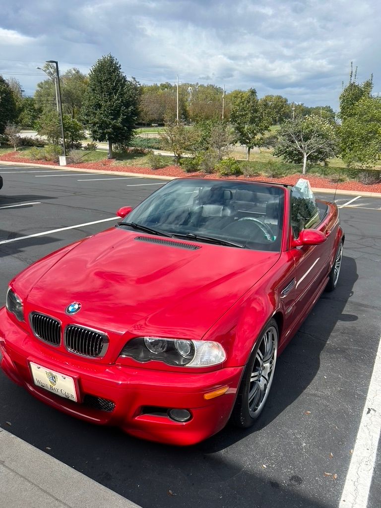 Red BMW M3 convertible after a detail in an Overland Park parking lot