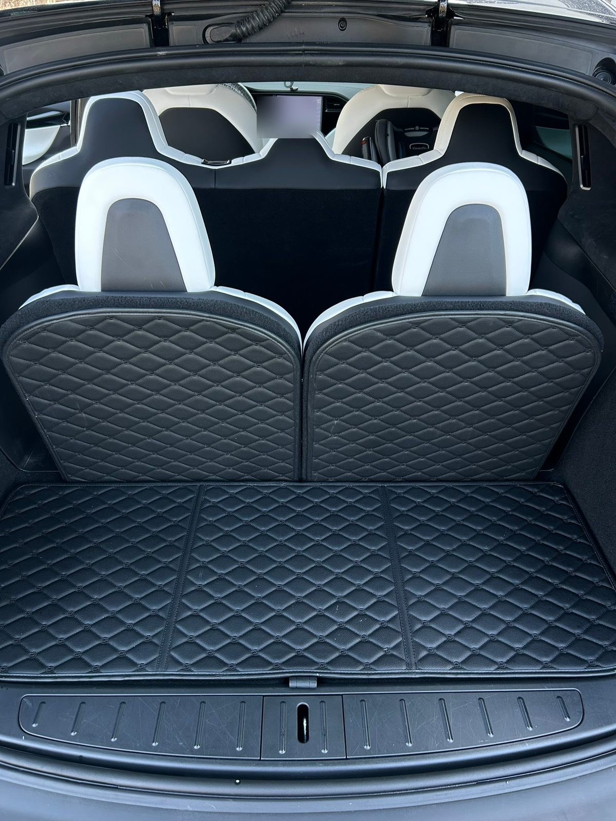 Tesla Model X cargo area and white seats after an interior detail