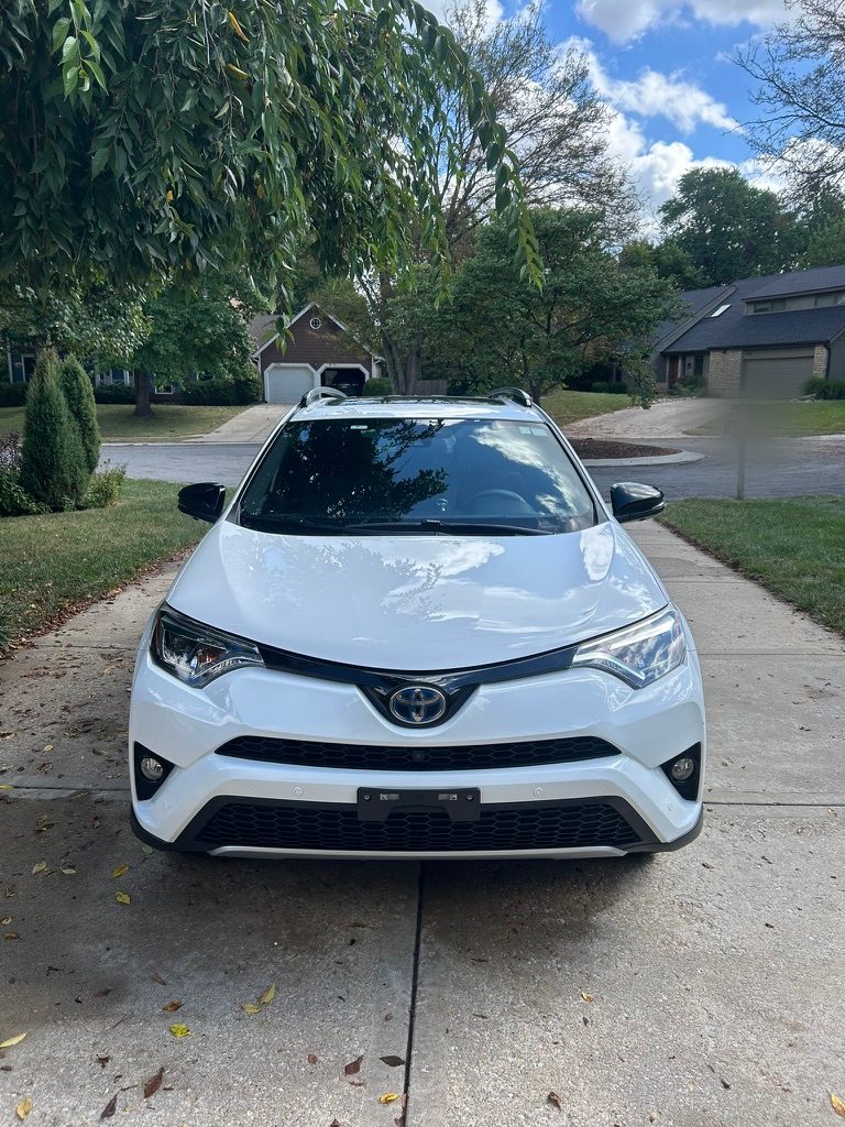 White Toyota RAV4 after a mobile exterior detail in a driveway